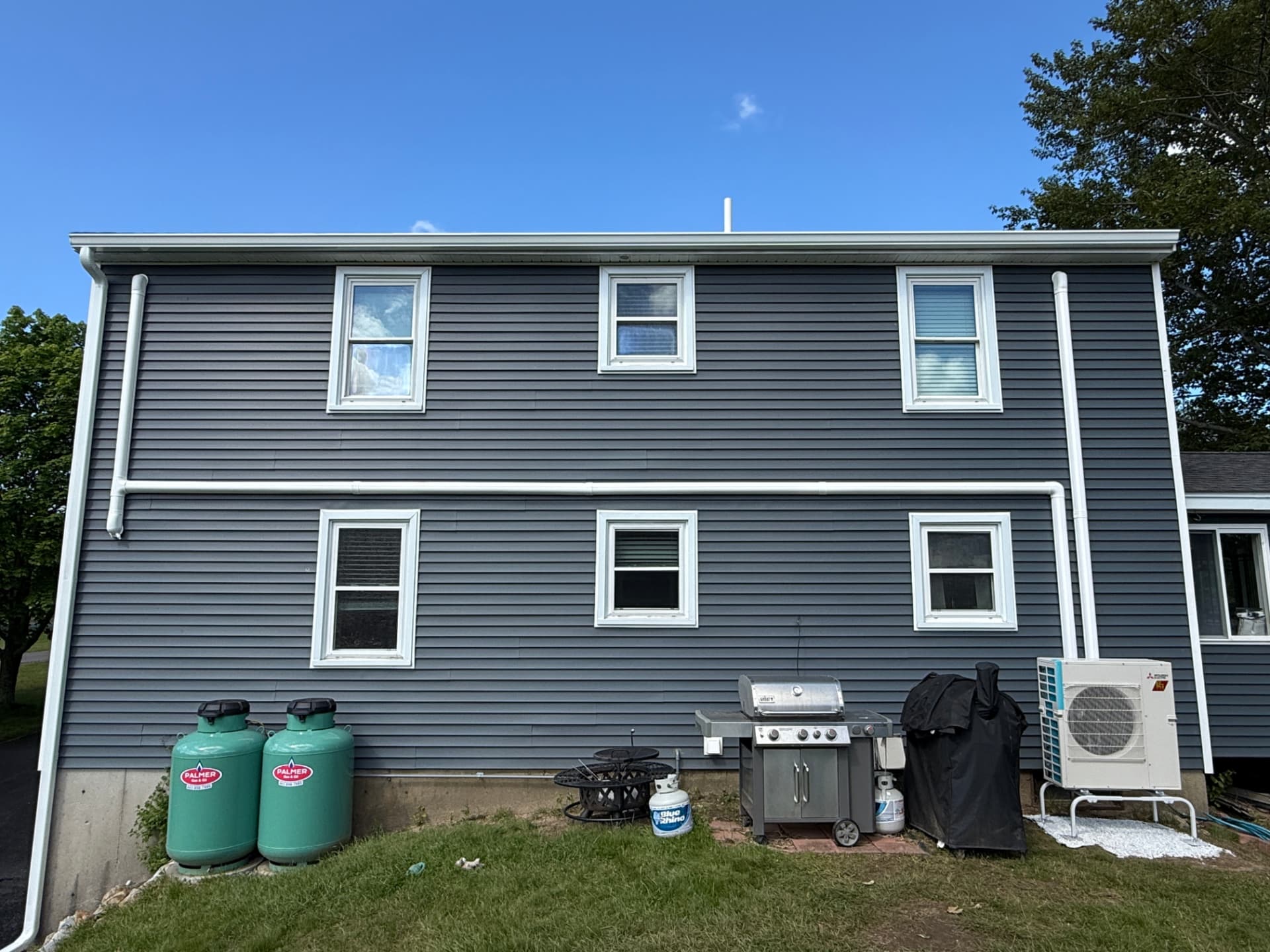 Finished multi-zone install with line hide blending into the siding